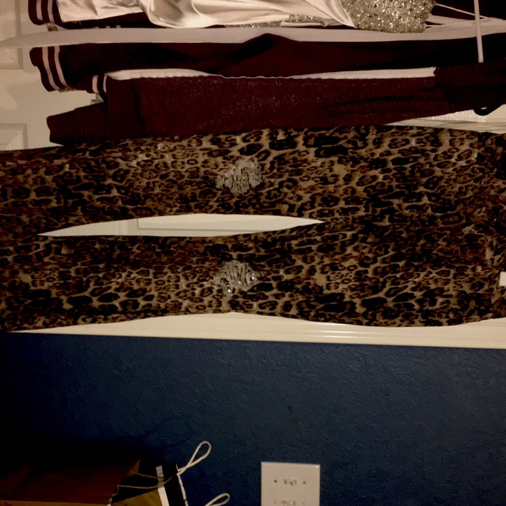 Never wore— cheetah print flair jeans with glitter